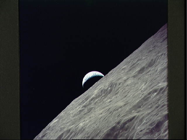 Cresent Earth rises above lunar horizon (taken by Apollo 17)