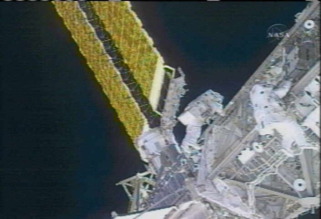 Picture taken shortly after the begin of the ISS SARJ inspection spacewalk on December, 18th 2007.
Image Credit: NASA TV