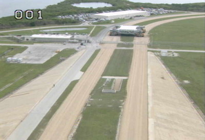 a crawler-transporter heading back from the launch pad