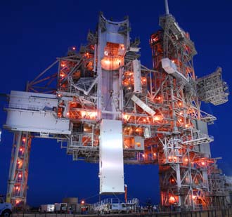 The STS-120 payload canister is being delivered to the launch pad