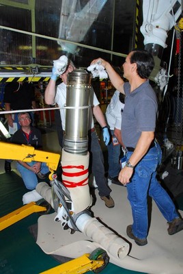 Shuttle Discovery's landing gear is being worked on. Photo Credit: NASA