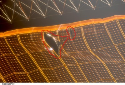 There can now be seen two rips in the solar array. Note the smaller one to the right.
Image Credit: NASA, Highlightning: Rainer Gerhards