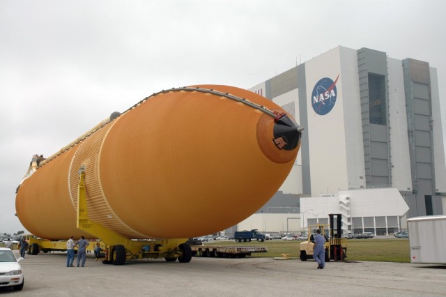 After being offloaded from the Pegasus barge at the Launch Complex 39 Area turn basin at NASA's Kennedy Space Center, the external tank is being transported to the Vehicle Assembly Building, in the background. The tank will be used for space shuttle Endeavour's STS-123 mission. Endeavour is targeted for launch to the International Space Station on Feb. 14. Photo credit: NASA/Jim Grossmann