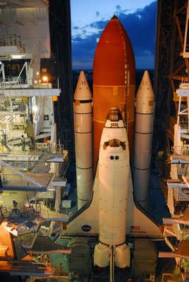 Space Shuttle Discovery begins moving through the doors of the Vehicle Assembly Building toward Launch Pad 39A.