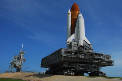 Space Shuttle Discovery climbs the five percent grade to the top of the hardstand at Launch Pad 39A.