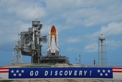 A banner at Launch Pad 39A proclaims the sentiments of the work force at Kennedy Space Center following the arrival of Space Shuttle Discovery on a balmy Florida afternoon.