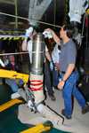 Shuttle Discovery's landing gear is being worked on. Photo Credit: NASA