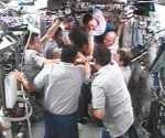  The STS-120 and Expedition 16 crew members bid farewell to each other. Image credit: NASA TV 