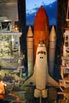 Space Shuttle Discovery begins moving through the doors of the Vehicle Assembly Building toward Launch Pad 39A.