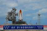 A banner at Launch Pad 39A proclaims the sentiments of the work force at Kennedy Space Center following the arrival of Space Shuttle Discovery on a balmy Florida afternoon.